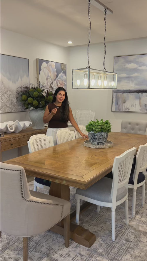 Rectangular solid oak dining table in hamptons style home