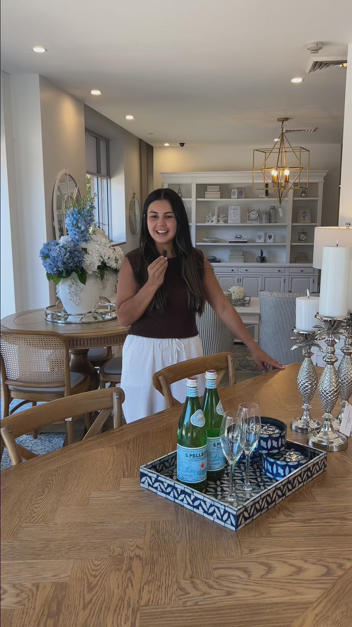 Rectangle solid oak dining table with herringbone inlay table top and cross leg detailing on the base. Family friendly durable finish with timeless design.